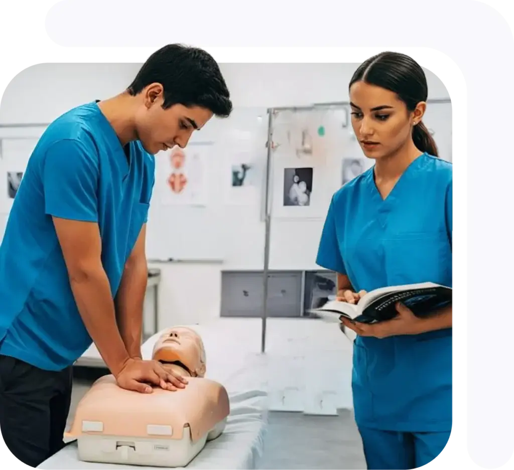 Two medical trainees practicing CPR on a mannequin during a training session.