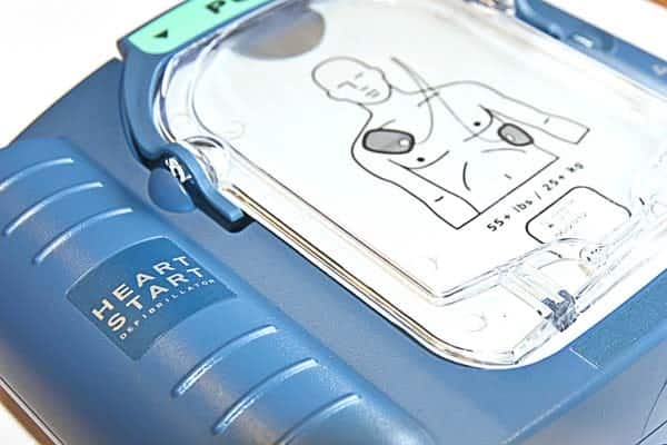HeartStart Defibrillator - American Heart Association Courses | BLS- ACLS - PALS HeartStart defibrillator with a clear display showing a human torso and electrode pad placement.